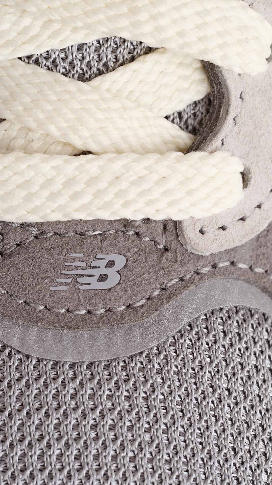 A close up detail shot of the material of the 990v7 sneaker.